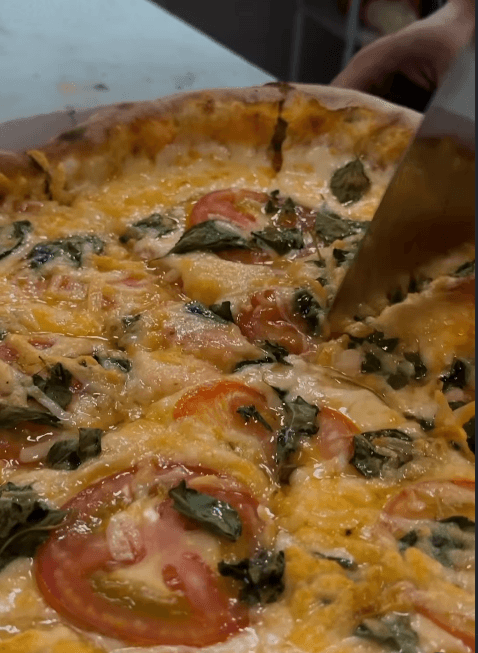 Pizza Marguerita - ingredientes artesanais bem recheados